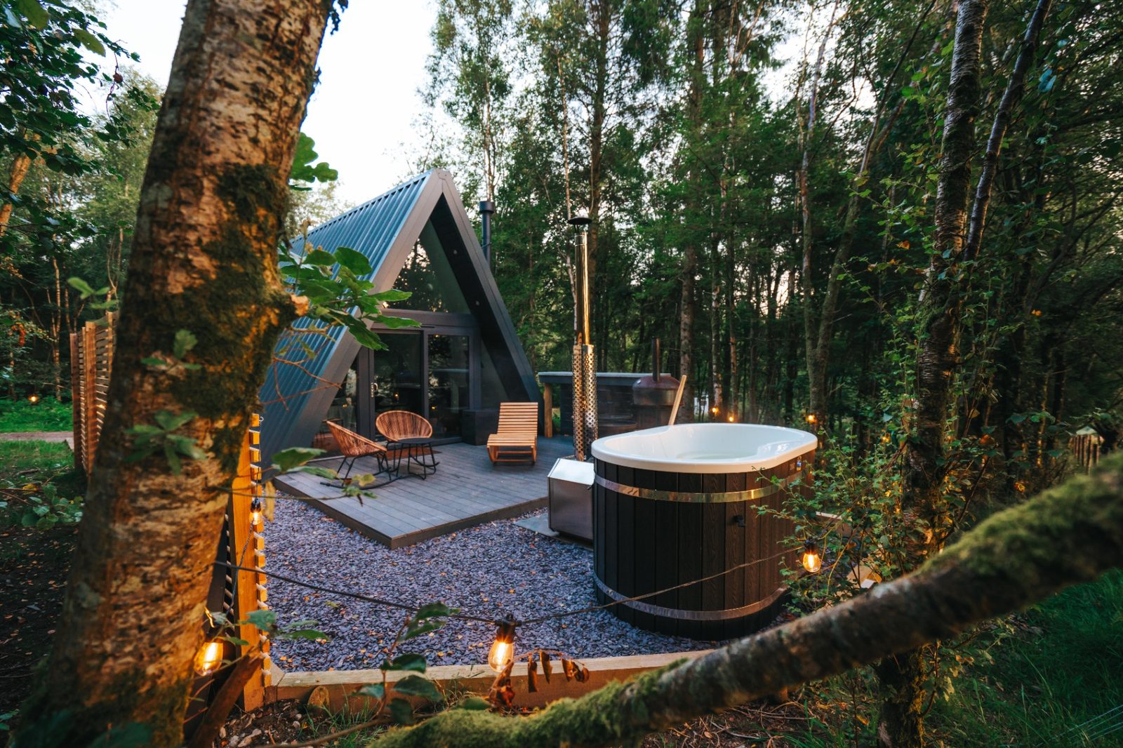 Woodland glamping cabin with private wood-fired hot tub at Porth Eryri Glamping in Eryri (Snowdonia), North Wales